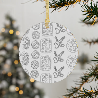 Round acrylic ornament with a pattern of scientific cell drawings.